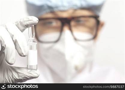 Female doctor holds&oule injection drug.. Female doctor holds&oule injection drug