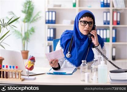 Female doctor in hijab working in the hospital