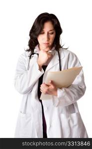 Female doctor in white coat looking at patient record chart and thinking about health, isolated.