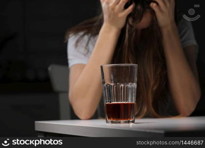 female doctor is depressed. lonely female drinker alcoholic suffer from alcohol addiction having problem, alcoholism concept. the consequences of a pandemic and self-isolation.. female doctor is depressed. lonely female drinker alcoholic suffer from alcohol addiction having problem, alcoholism concept. the consequences of a pandemic and self-isolation