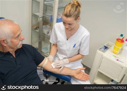 female doctor is doing blood test