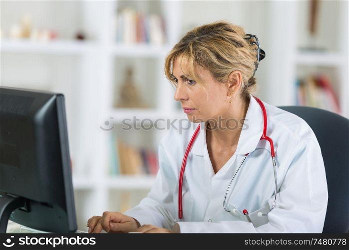 female doctor looking at computer in hospital