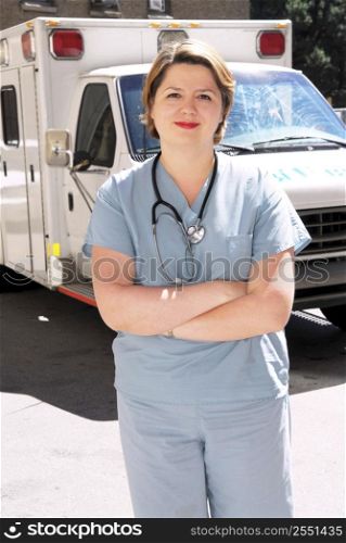 Female doctor or paramedic in front of an ambulance
