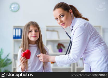 Female doctor pediatrician checking girl