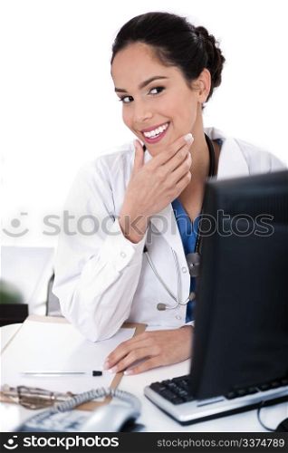 Female doctor portrait smiling and looking computer on white background
