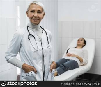 female doctor posing patient