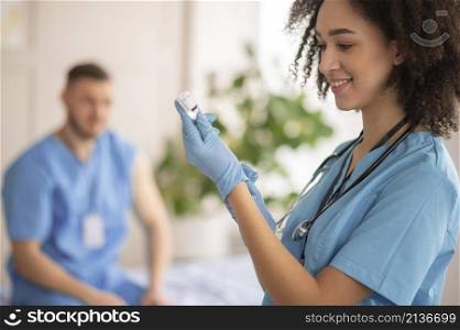 female doctor preparing vaccination her colleague