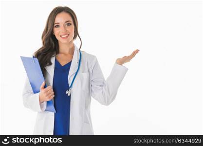 Female doctor showing something. Portrait of happy smiling young female doctor showing something or blank area for text, or copyspace, isolated over white background