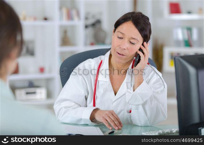 female doctor talking on the phone