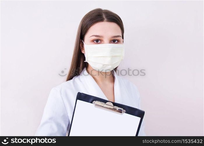 Female doctor wearing protection face mask. Covid-19 concept.