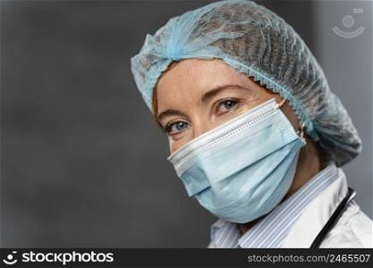 female doctor with medical mask hairnet with copy space