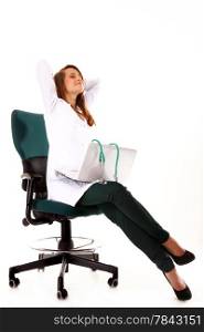 Female doctor working on her laptop stretching at her workplace against a white background