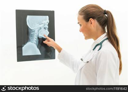 Female doctor working with x ray film of patient head and diagnose skull injury. Medical and healthcare staff service concept.