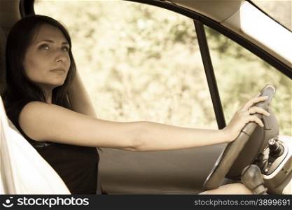Female driver woman holding steering wheel of a car, driving auto.