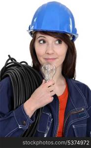 Female electrician with a lightbulb