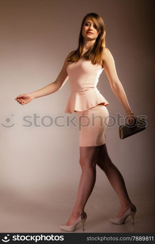 Female elegance. Full length of attractive girl young woman with elegant handbag bag luxury accessory on gray