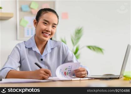 female employee holding a pen to write documents in office