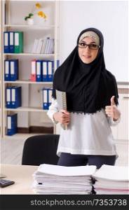 Female employee in hijab working in the office 