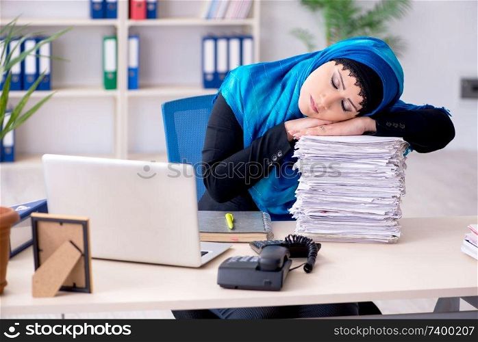 Female employee in hijab working in the office