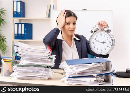 Female employee with too much work in the office