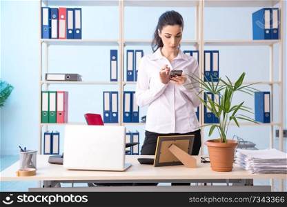 Female employee working late in the office 