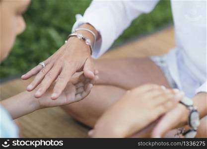 Female energy healer performing alternative therapy treatment with client. Therapist holding hands with patient, transferring energy.. Healing Hands of a Spiritual Healer