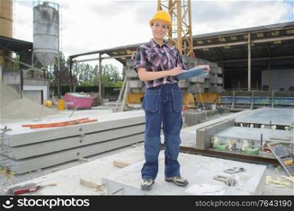 female engineer worker on construction site outdoors
