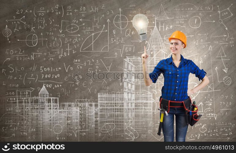 Female engineer. Young pretty woman engineer with tool belt on waist