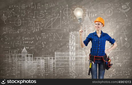 Female engineer. Young pretty woman engineer with tool belt on waist