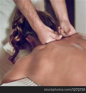 Female Enjoying Relaxing Back Massage In Cosmetology Spa Center