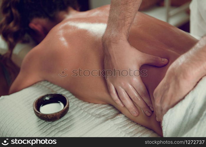 Female Enjoying Relaxing Back Massage In Cosmetology Spa Center