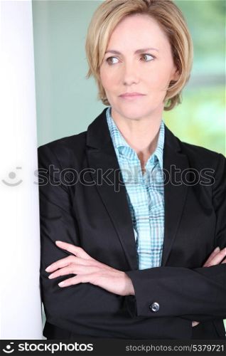 Female executive with arms folded