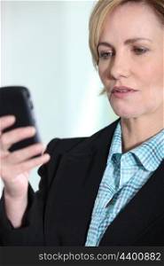Female executive with mobile phone