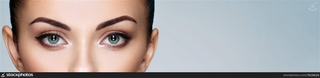 Female Eye with Extreme Long False Eyelashes. Eyelash Extensions. Makeup, Cosmetics, Beauty. Close up, Macro