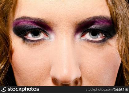 female face close-up with make up in glam rock style