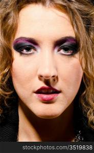 female face with make up in glam rock style