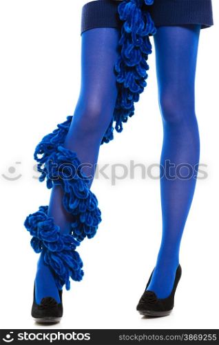 Female fashion. Woman long legs blue stockings high heels and warm scarf around leg isolated