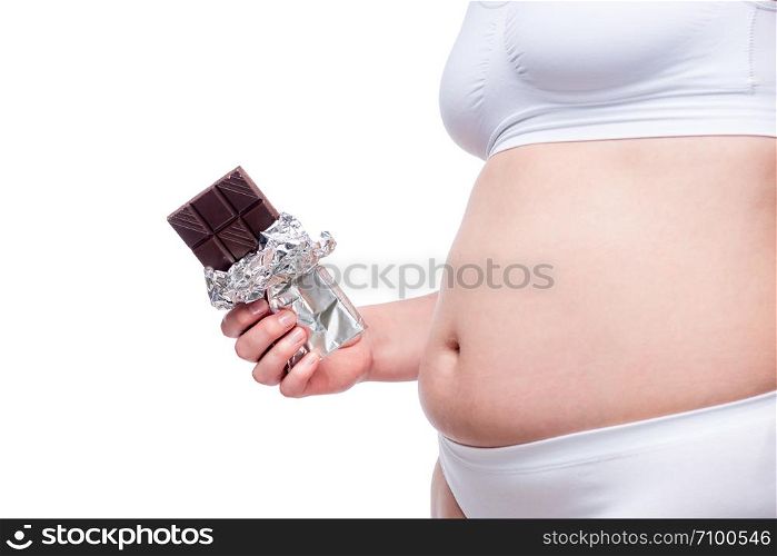 female fat belly in underwear with chocolate and isolated on white background