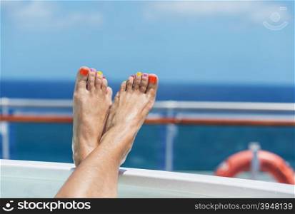 female feet on board a cruise ship - the concept of a cruise vacation