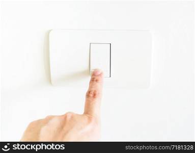 female Finger press on light button.