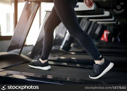 Female fitness run on treadmill