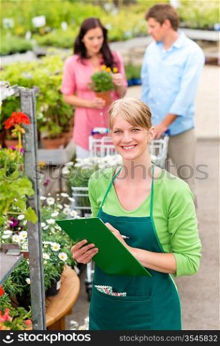 Female florist working at garden center do retail inventory