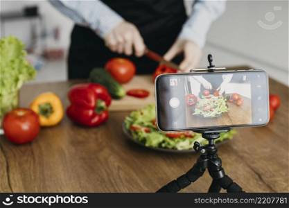 female food blogger streaming home while cooking