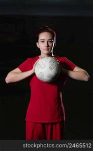 female football player holding ball