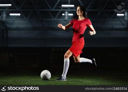 female football player kicking ball 3