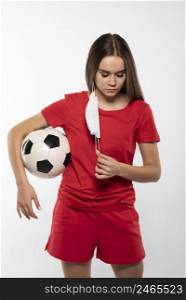 female football player with mask holding ball 4