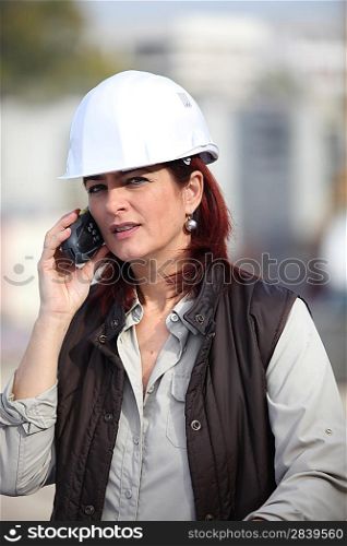 Female foreman using radio to communicate