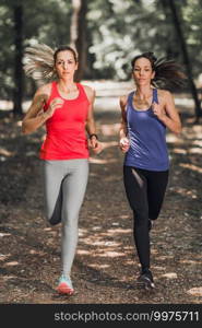 Female Friends Enjoy Running Outdoors