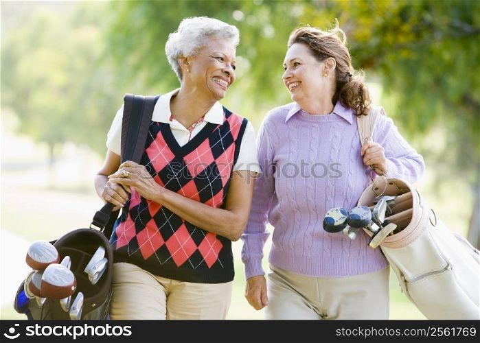 Female Friends Enjoying A Game Of Golf