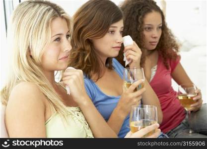 Female Friends Watching A Sad Movie Together